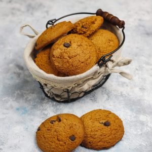 Homemade oatmeal cookies with chocolate chips on concrete  backg